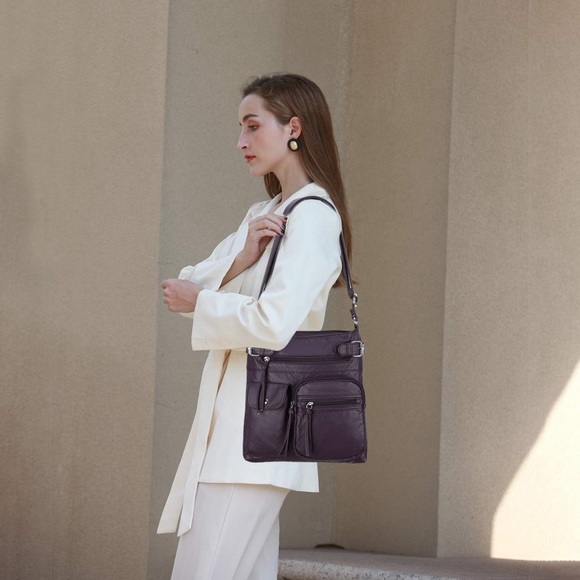 Super soft cross body purse purple handbag with organizational pockets!

049 - Picture 3 of 5